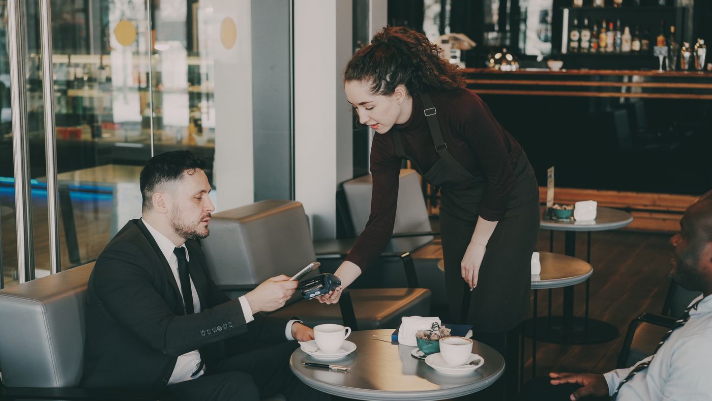 Two people reviewing documents together at a table