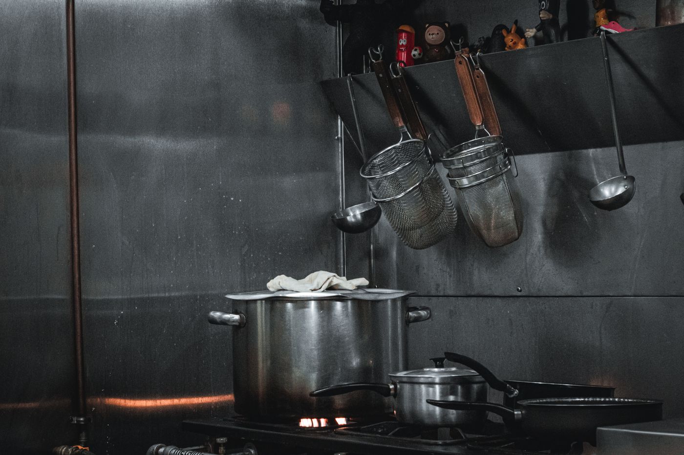 Stainless steel commercial kitchen with professional cooking equipment